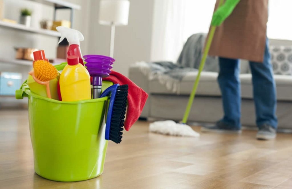 House cleaning service in action with professional equipment